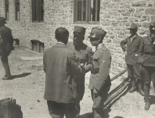 Touring Club member with two officers of the First Army.