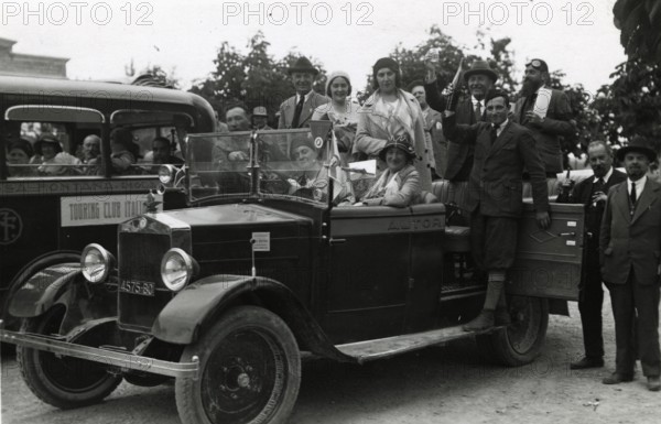 Members of the Touring Club Italiano  on board a car. 
	
		1931