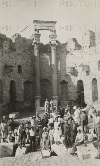 Excursionists in the Basilica of the Severi in Leptis Magna. 
	
		1931