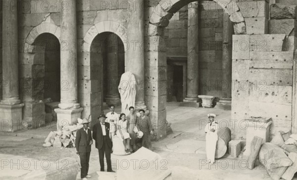 Excursionists in the Severan Forum in Leptis Magna. 
	
		1931