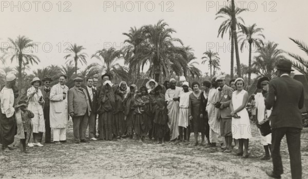 Excursionists in Libya together with some indigenous people. 
	
		1931