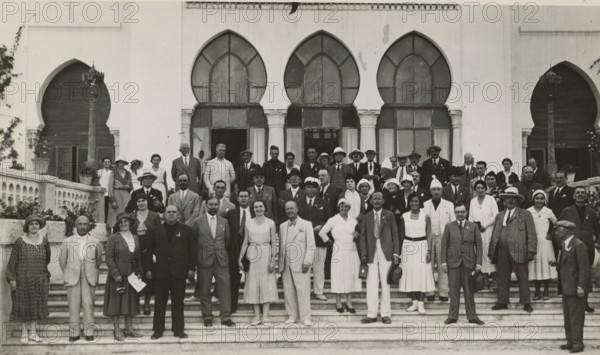 Excursionists at the entrance to the Grand Hotel in Tripoli. 
	
		1931