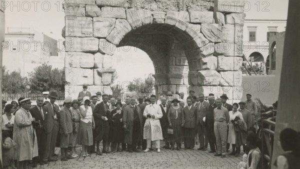 Excursionists in front of the Arch of Marcus Aurelius in Tripoli. 1931