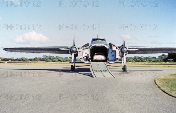 Silver City Airways air ferry, car loading onto Bristol Superfreighter plane, Ferryfield airport, Lydd, Kent England, UK 1959.