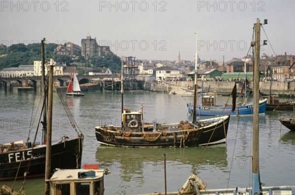Boats in the harbour, Folkestone, Kent, England, UK early 1960s.