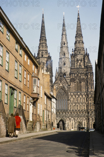 People walking in The Close towards Lichfield cathedral church, Lichfield, Staffordshire, England, UK early 1960s.