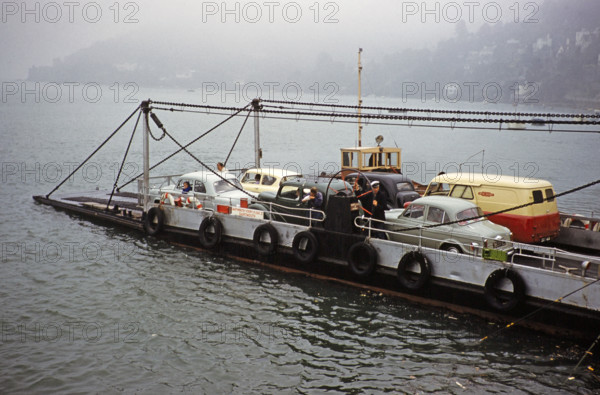 Cars and van on vehicle ferry, between Kingswear and Dartmouth, Devon, England, UK early 1960s.