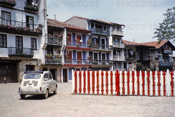 Fiat 600D car in historic area of Hondarribia or Fuenterrabia, Basque country, northern Spain, 1959.
