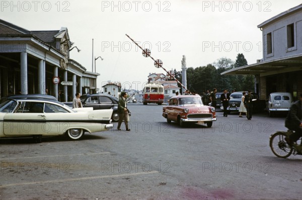 Frontier border vehicles crossing between Spain and France at Irun, northern Spain, 1959 red Opel Rekord car.