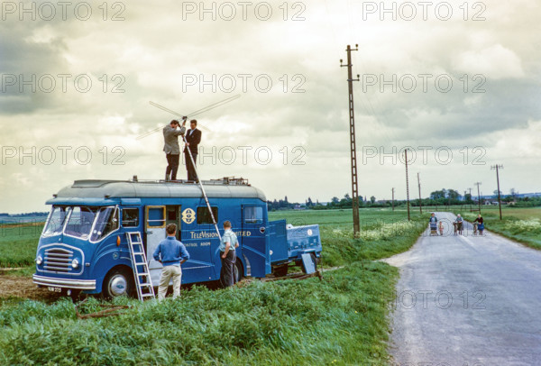 ATV television ITV company outside broadcast vehicle, erecting television antenna aerial on top of van, UK 1960s.