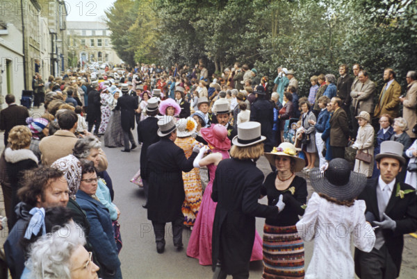 Flora Day, Helston, Cornwall, England, UK 1973 - crowds watch couples perform the  Furry dance in the streets of the town.