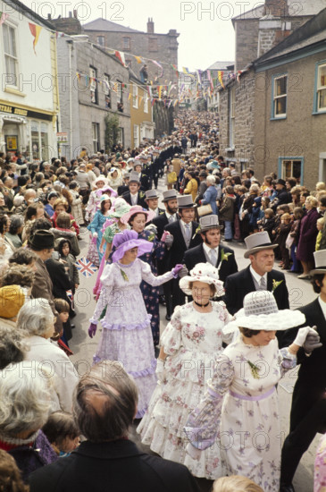Flora Day, Helston, Cornwall, England, UK 1973 - crowds watch couples perform the  Furry dance in the streets of the town.