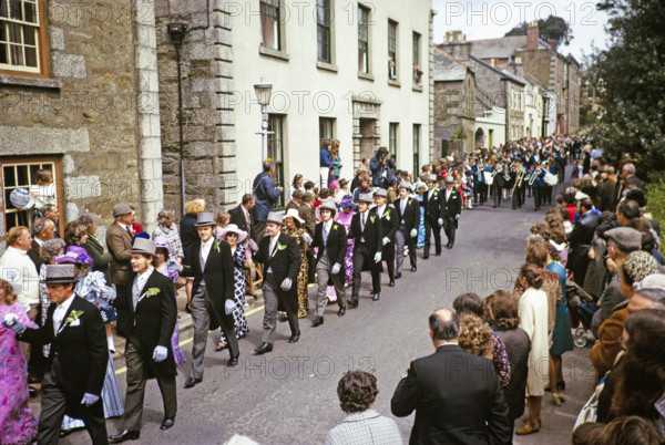 Flora Day, Helston, Cornwall, England, UK 1973 - crowds watch couples perform the  Furry dance in the streets of the town.