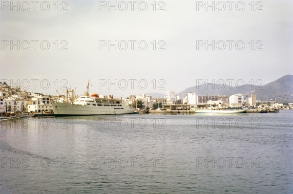 Ciudad de Barcelona' passenger cargo ship built 1957 in port area, Ibiza town, Ibiza, Balearic Islands, Spain 1967.