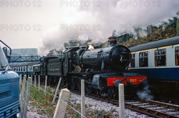 Locomotive 7827 Lydham Manor steam engine train, Dart Vally Railway, Dartmouth Steam railway, south Devon, England, UK 1975  with Great Western railway livery.