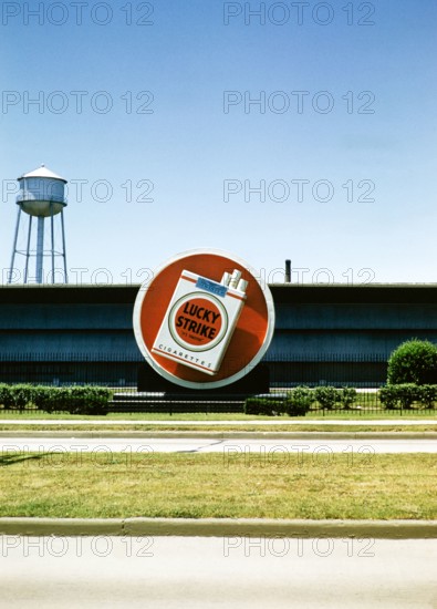 Lucky Strike cigarette advert, Philip Morris tobacco factory, thought to be Durham, North Carolina. USA c 1953.
