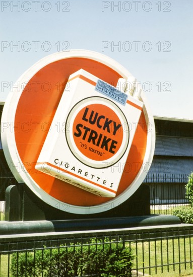 Lucky Strike cigarette advert, Philip Morris tobacco factory, thought to be Durham, North Carolina. USA c 1953.