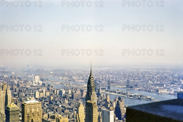 View from Empire State Building over Chrysler Building to East River, Roosevelt Island, Queensboro Bridge, Manhattan, New York, NY State, USA c 1953.