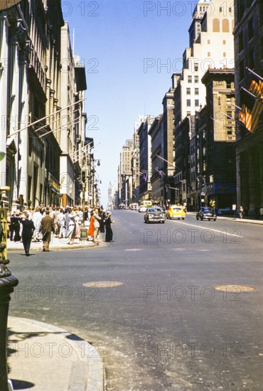 People and traffic on Fifth Ave 34th Street looking north, Manhattan,  New York, NY State, USA c 1953.