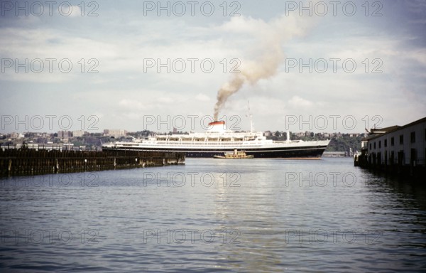 SS Cristoforo Colombo ocean liner ship, East River, Manhattan, New York, NY State, USA, c 1954.