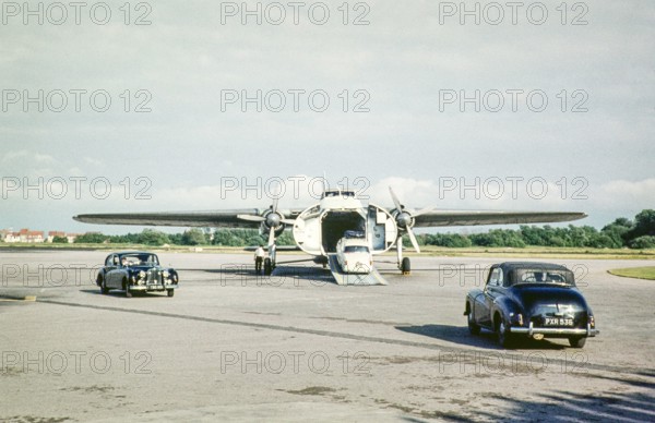 Cars being being loaded onto cross-channel freighter aircraft Silver City Airways, Le Touquet airport, France, Europe July 1961.