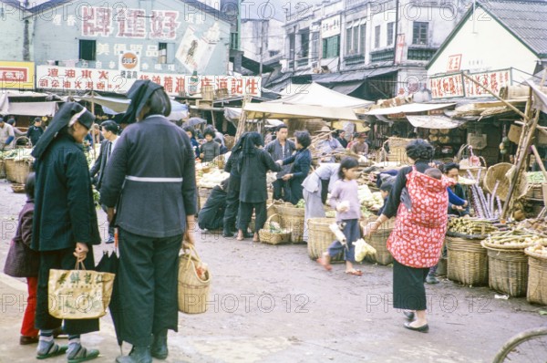 Country women at market, Tai Po, New Territories, Hong Kong, Asia, 1964.