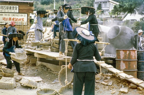 Women workers working at road construction site, Tai Po, New Territories, Hong Kong, Asia, 1964.