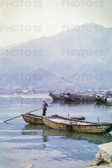 People living on sampan boats probably at Tide Cove, New Territories, Hong Kong, Asia, 1964.