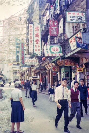 Captioned as 'Chinese flower stalls', Victoria, Hong Kong, Asia 1964 - note bamboo scaffolding.