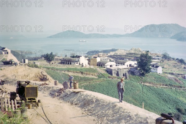 Captioned as 'Dairy land and road widening', Pok Fu Lam, Hong Kong, Asia 1964.