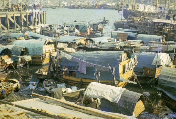 People living on sampan boats in the harbour at Aberdeen, Hong Kong, Asia 1964.