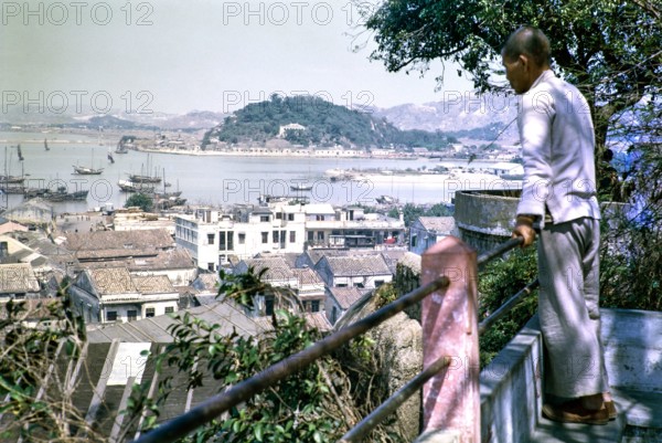 View from Monte Fort over rooftops of high density buildings in city centre, Macau, Asia 1964.