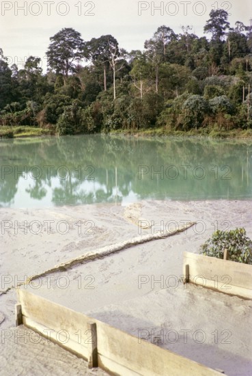 Open Cast gravel-pumping tin mine Malaya, Malaysia, south east Asia 1964 - slurry runs off into tailing pond.