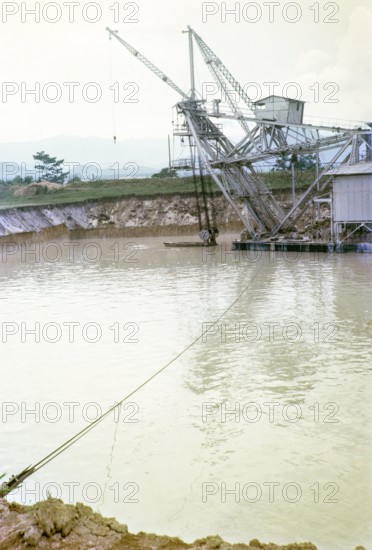 Tanjung Tualang Dredge No.5 (TT5) tin mining dredger built in England in 1938 by F.W.Payne & Son, Batu Gajah, Perak, Malaya, Malaysia, south east Asia 1965.