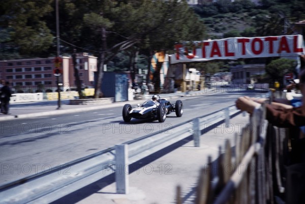 Formula One motor racing Monaco Grand Prix race 1961, Jack Brabham in Cooper-Climax racing car, passing pits.