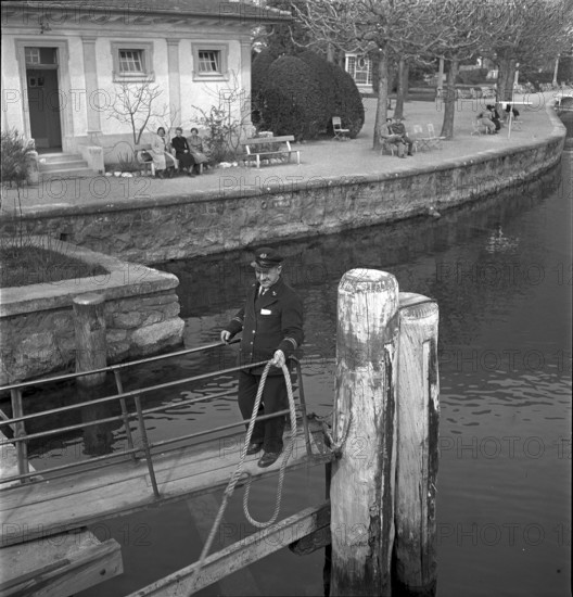People relax bear a landing stage, Lake Lucerne 1940