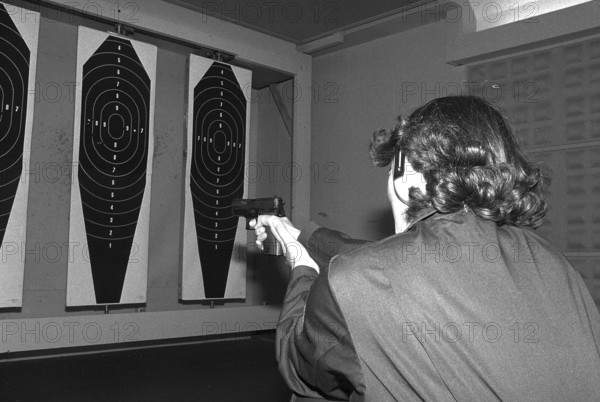 Policewoman Emma Meier at target practice 1981