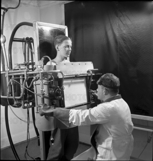 Boy undergoing physical examination by doctor, Zurich 1947