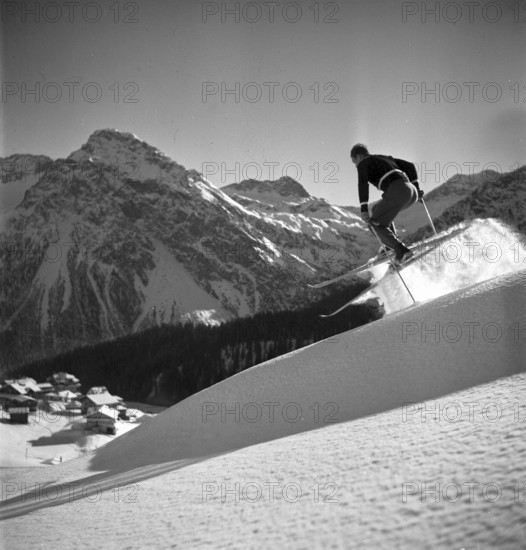 Ski instructor shows proper way to ski, jump, Arosa 1938