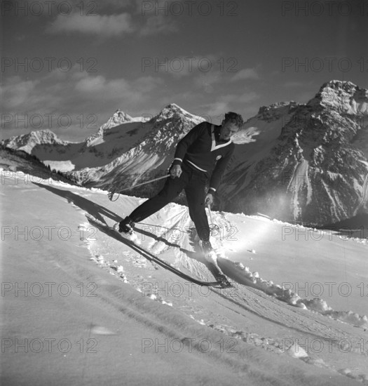 Ski instructor shows proper way to ski, stem turn, Arosa 1938