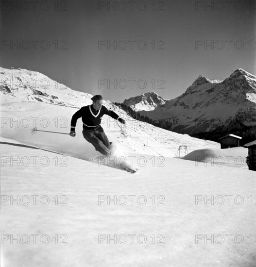 Ski instructor shows proper way to ski, Arosa 1938