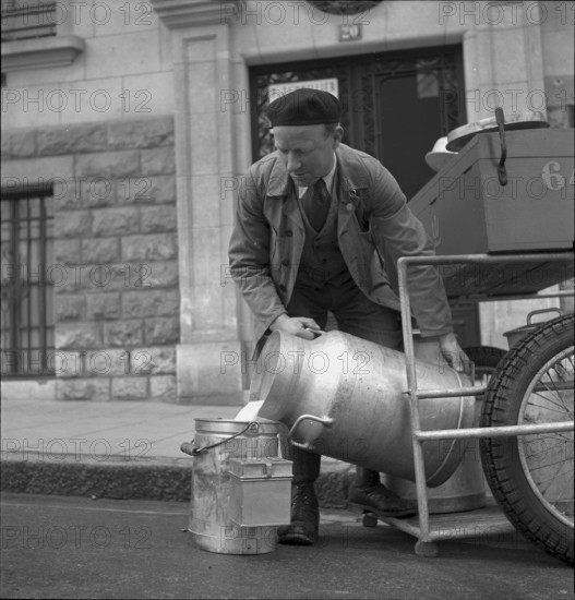 Milkman delivering milk in Geneva 1943