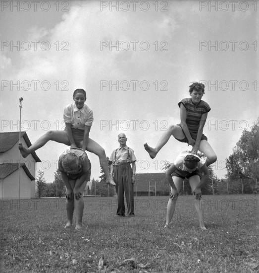 Wangi, teacher giving an outdoor gym lesson, 1955