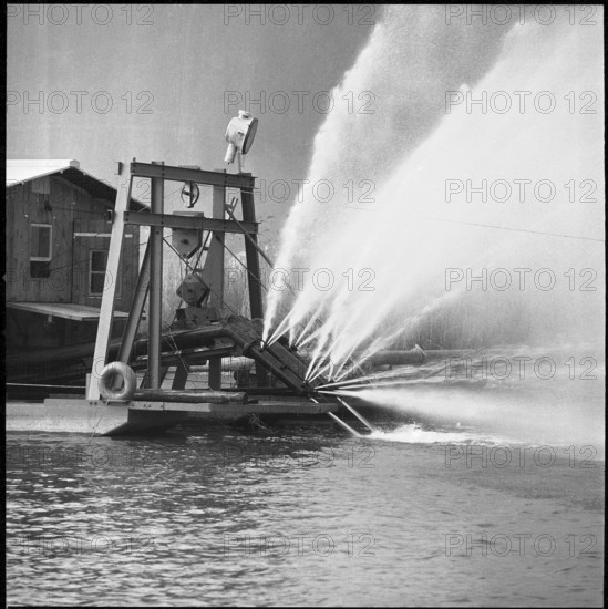 Dredger taking out gravel, shingle from the bottom, 1957