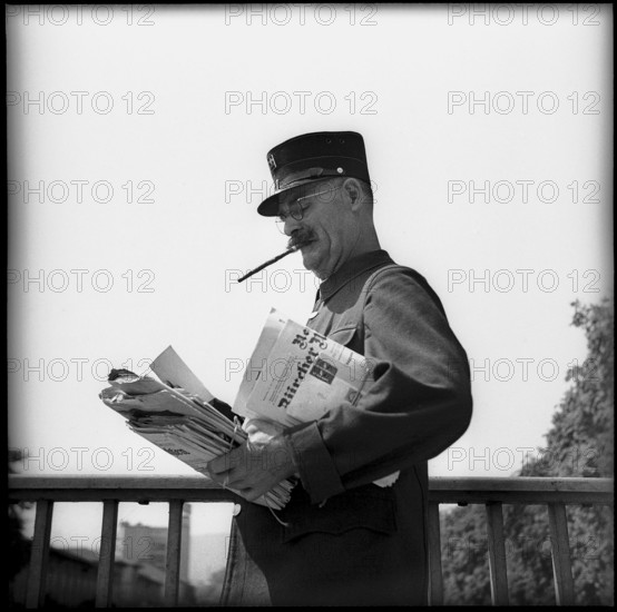 Postman smoking a cigar in Zurich 1947