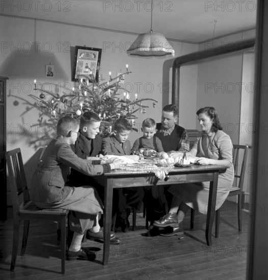 Christmas 1951: Railway guard in La Gordane, with family