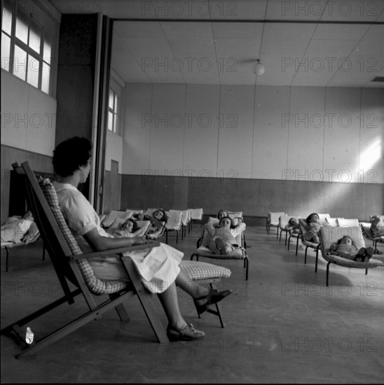 Rheinfelden thermal spa, nurse looking after relaxing girls. 1952