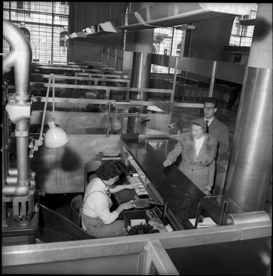 Postal cheque services, client at the Fraumunster post office Zurich, 1956