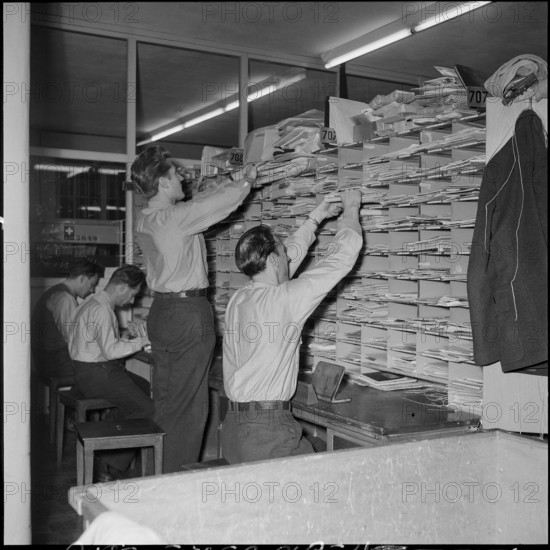 Rush before christmas, temporary post office in a gym, Berne 1957