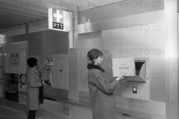 Customer at self service post office counter, Bern Gabelbach 1969